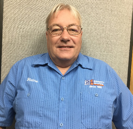 Blaine Aldrich smiling, wearing a blue striped Comfort Service work shirt.